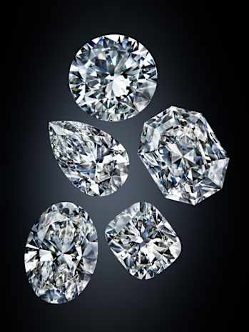 Swarovski Created Diamonds Earrings Model wears lab grown diamond rings and earrings by Swarovski