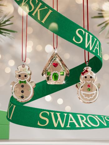 Three Swarovski crystal gingerbread ornaments.
