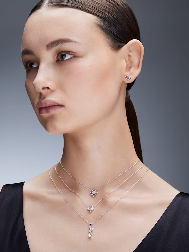 three different styles of lab grown diamond necklaces from the Swarovski range