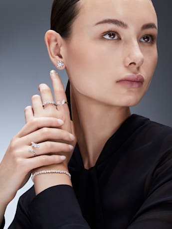 model wears lab grown diamond jewelry range by Swarovski