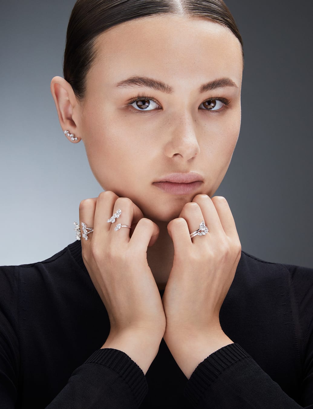 model wears laboratory grown diamond necklaces and earrings by Swarovski 