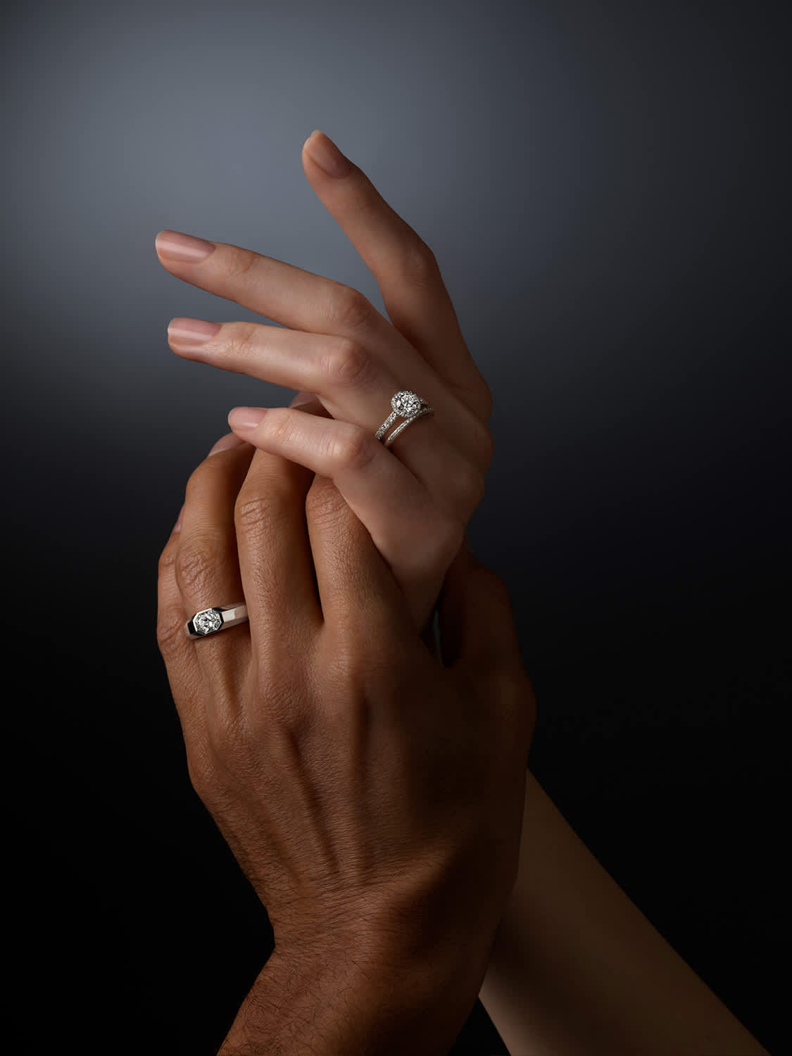 Two hands wearing Swarovski Created Diamonds rings