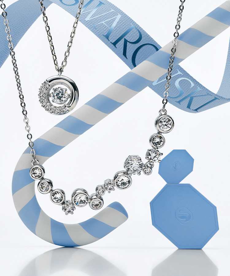 Biżuteria Swarovski z niebieskimi ozdobnymi pudełkami