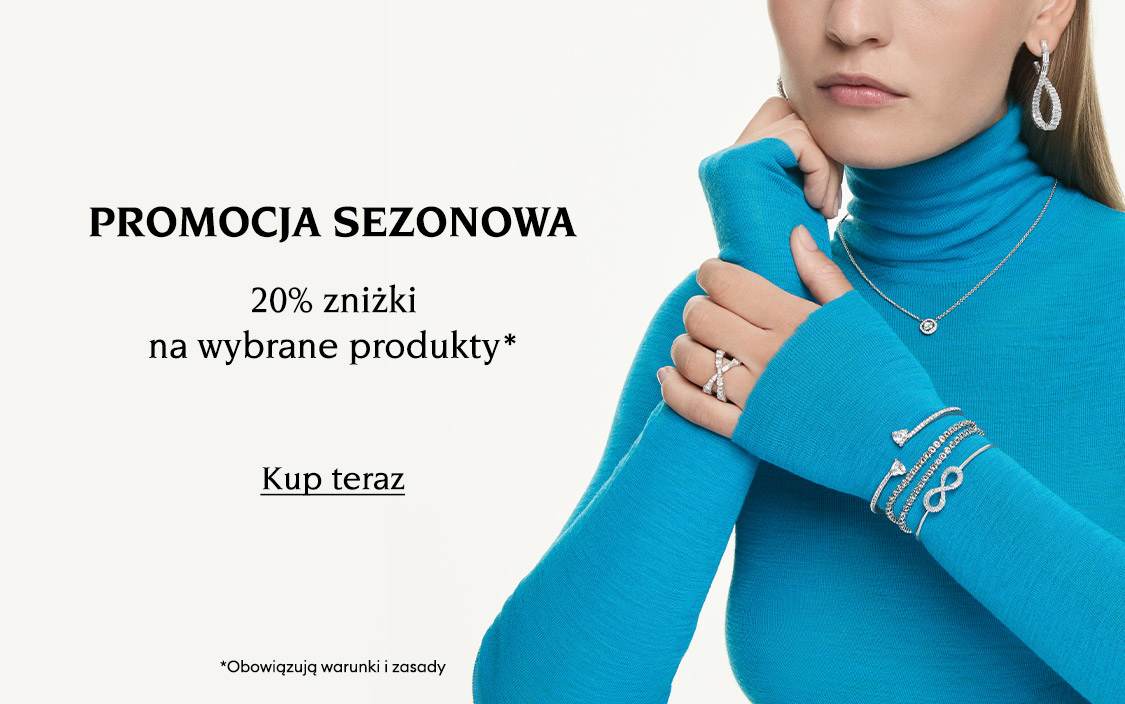 Modelka w biżuterii Swarovski. Tekst brzmi: „PROMOCJA SEZONOWA 20% zniżki na wybrane produkty*”. Napis na przycisku brzmi: „Kup teraz”. Ostatni tekst na zdjęciu brzmi: „Obowiązują warunki i zasady”