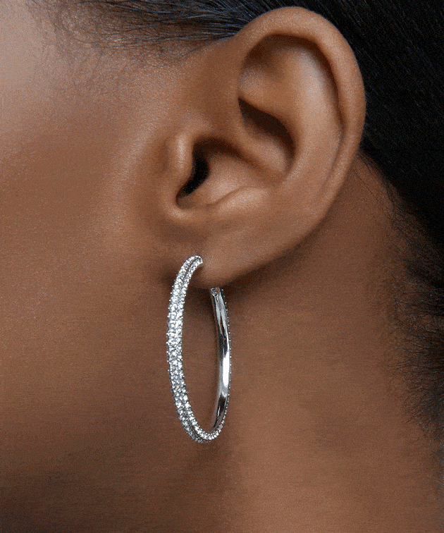 Model wearing Swarovski earrings