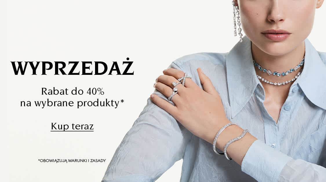 Modelka w biżuterii Swarovski. Napis brzmi: „WYPRZEDAŻ Rabat do 40% na wybrane produkty* Kup teraz *OBOWIĄZUJĄ WARUNKI I ZASADY”