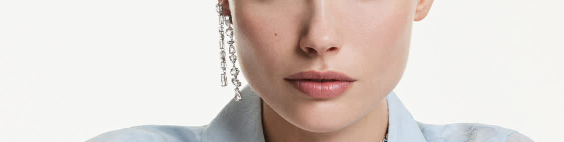 Model wears Swarovski earrings