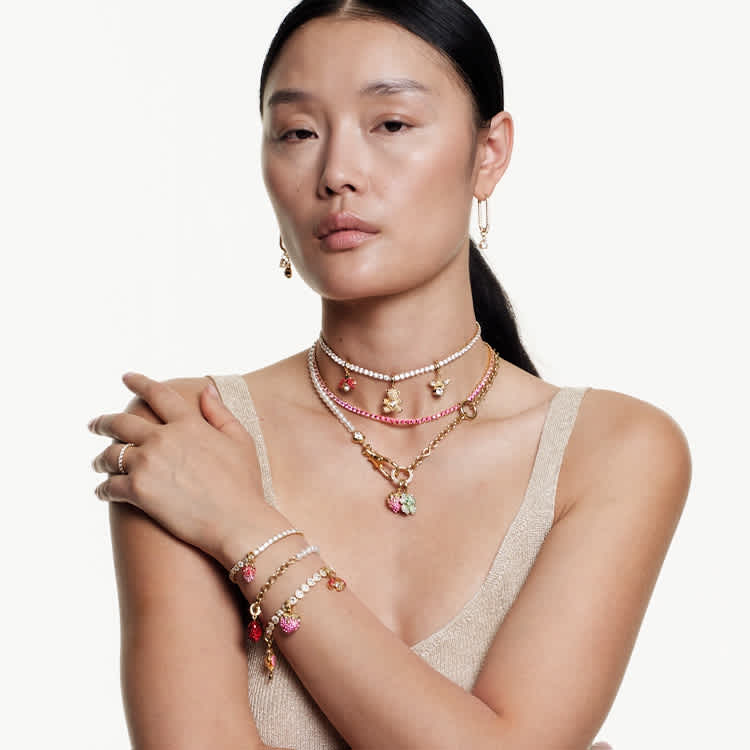 Model wearing charm jewellery
