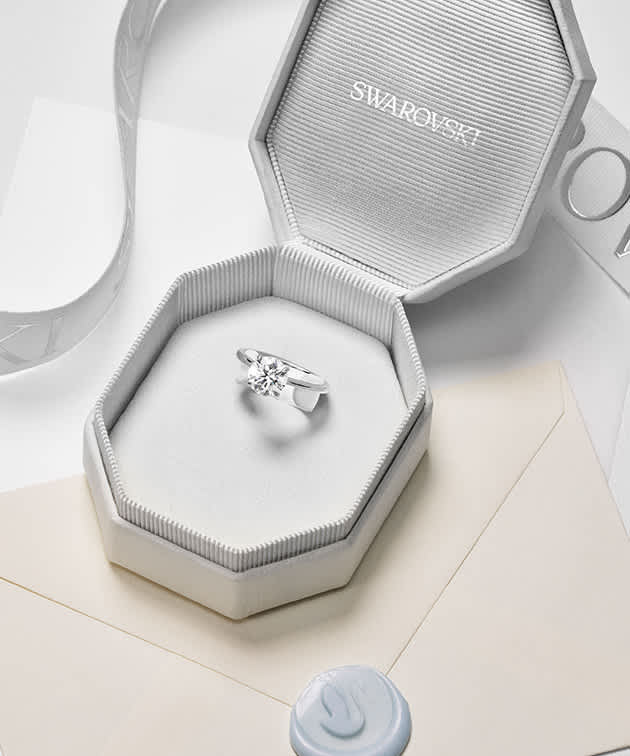 Diamond ring in an open jewellery box.