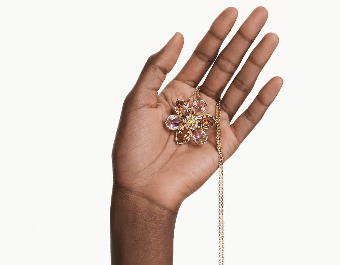 Hand holds a Swarovski necklace
