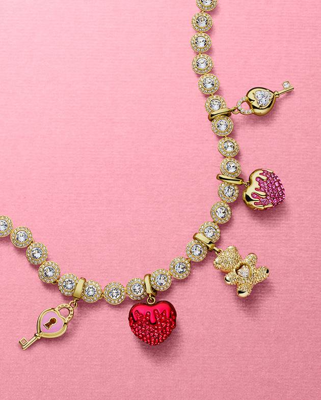 Swarovski charms on pink background