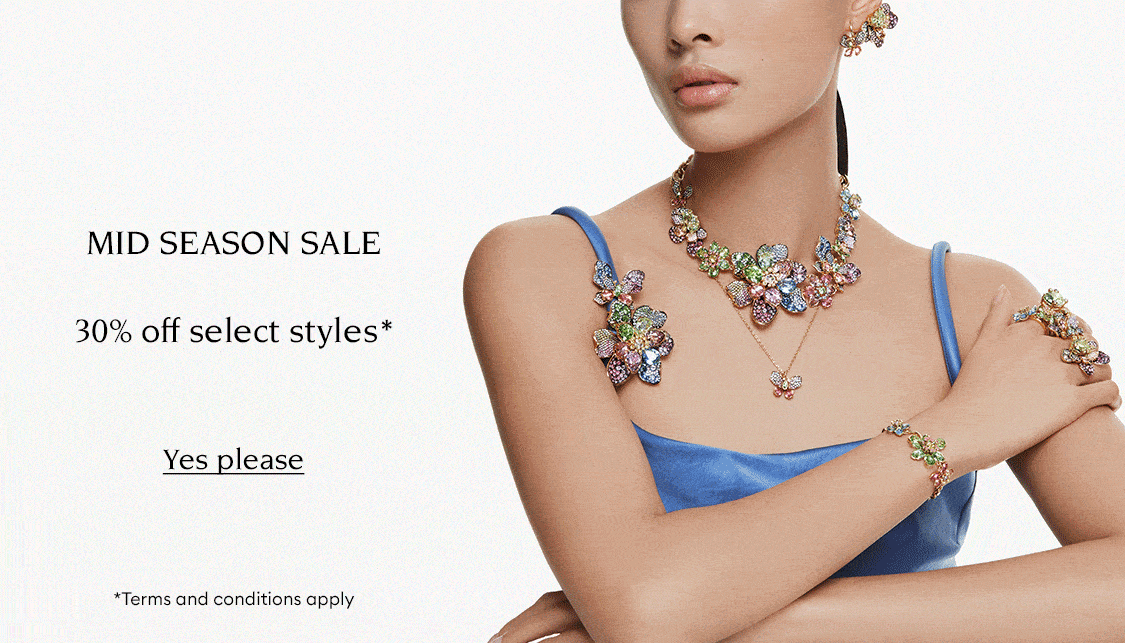 Model wearing Swarovski jewellery. Text reads 