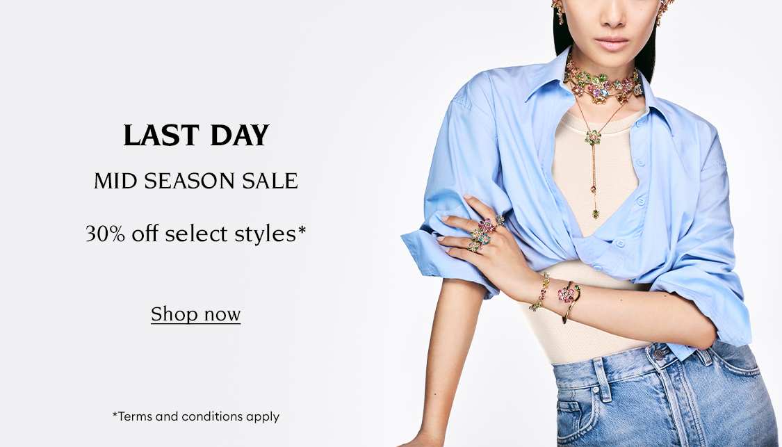 Model wearing Swarovski jewellery. Text reads 